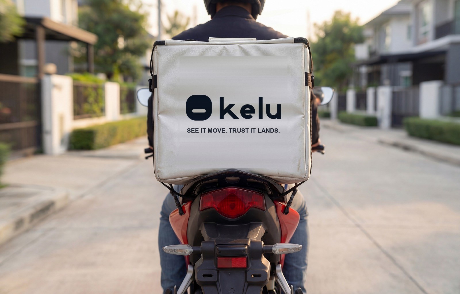 An Kelu rider on a motorbike with a branded Kelu delivery bag