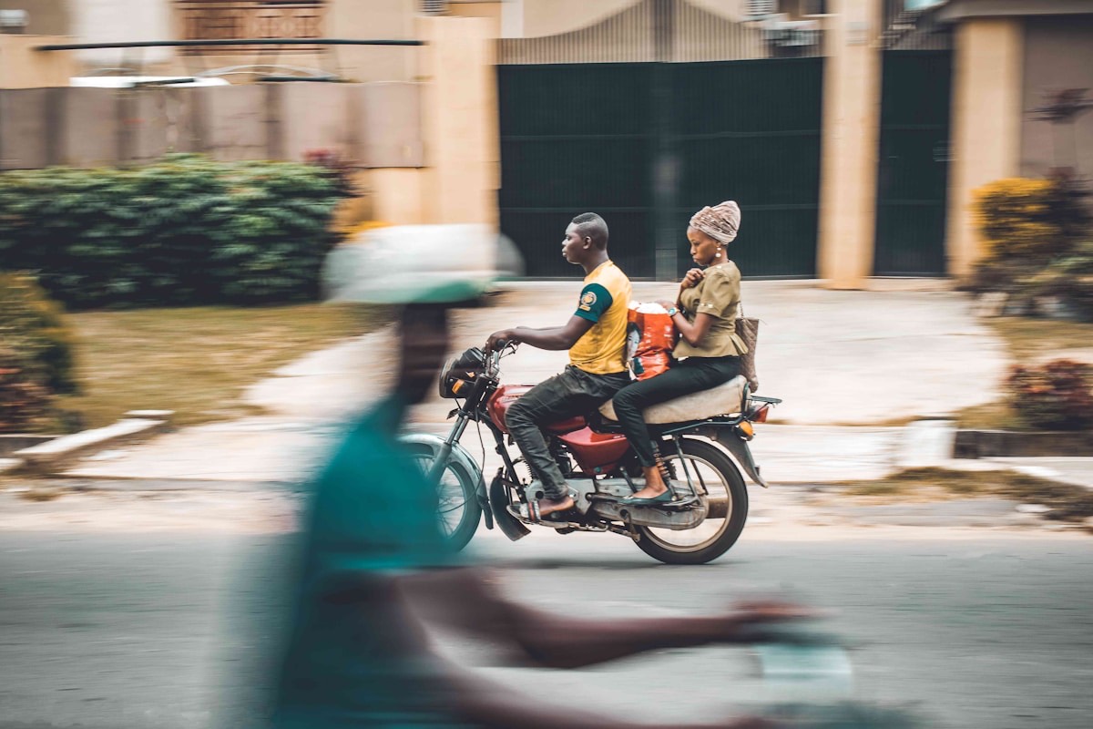 A Nigerian motorbike dispatch rider on a city street